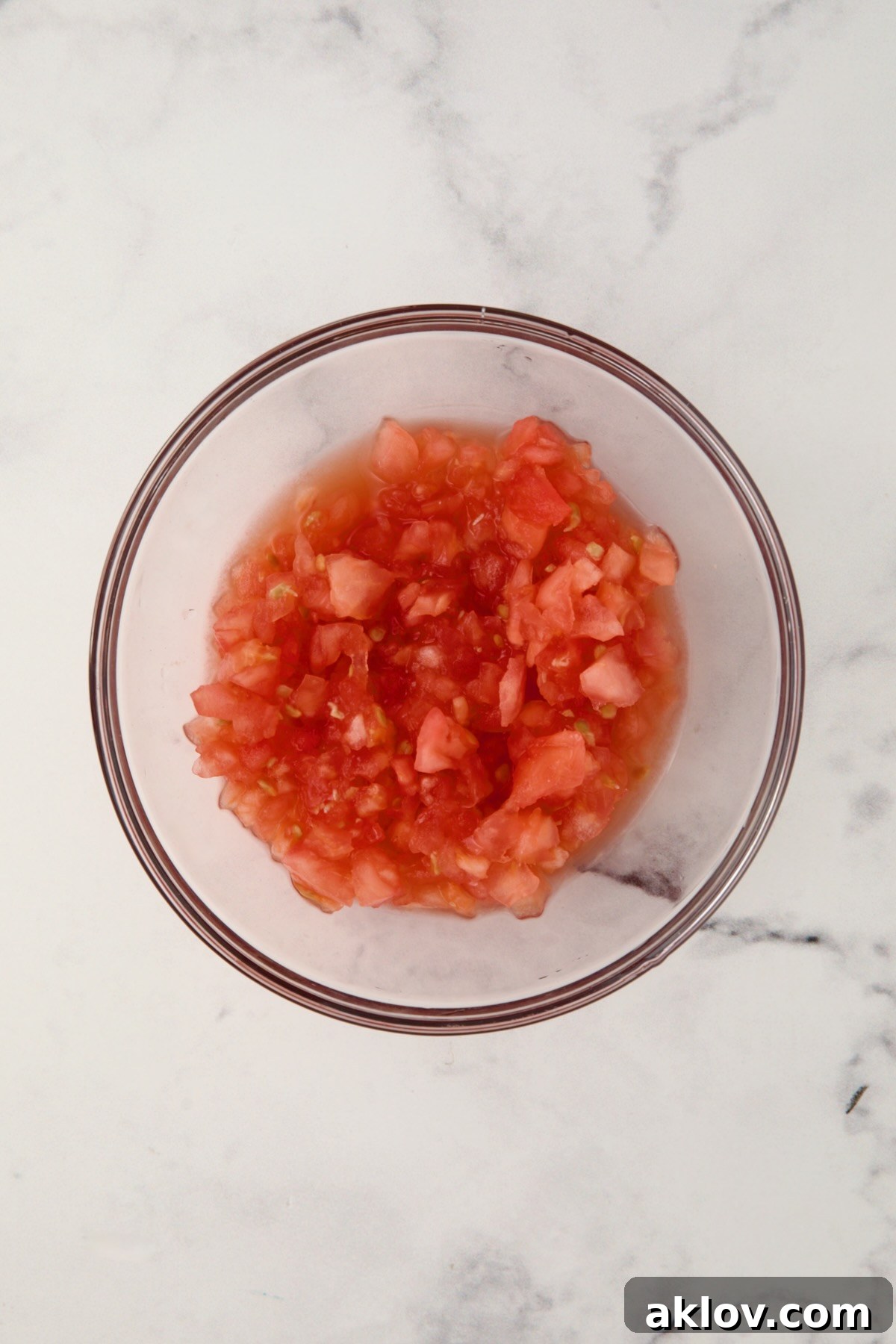 Cleaned up tomato pulp in a glass bowl, ready for chopping.