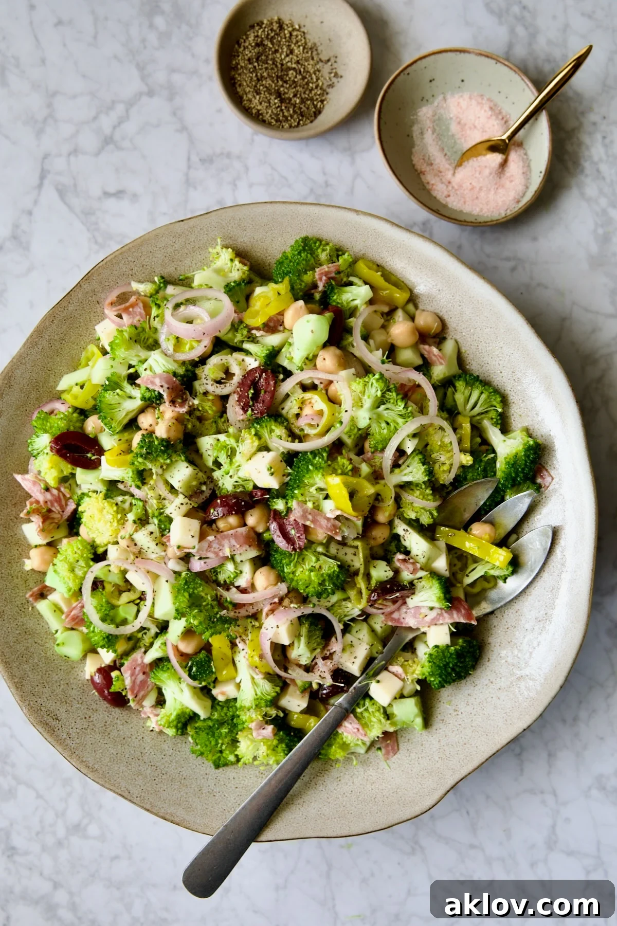 Italian Broccoli Salad in earthenware bowl with serving fork.