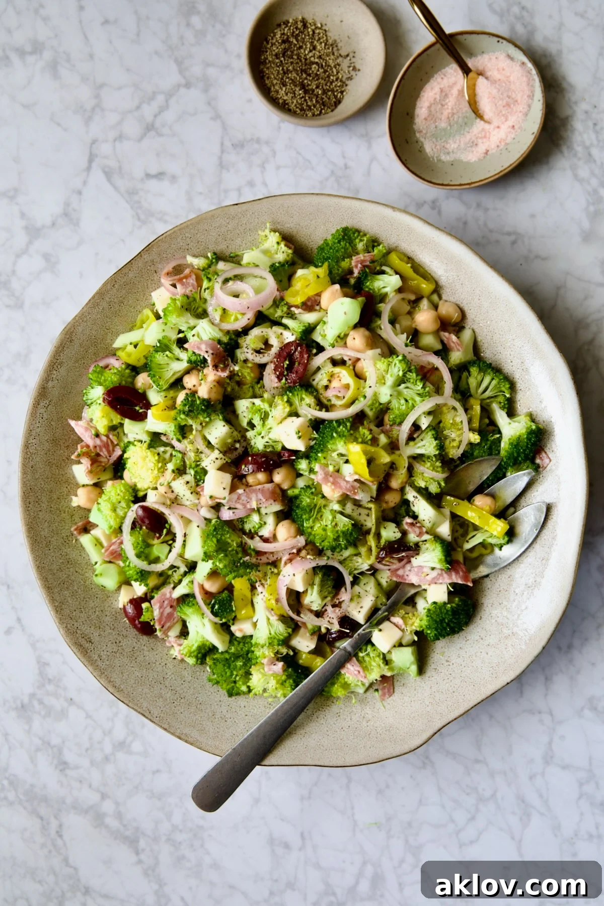 Italian Broccoli Salad in earthenware bowl with serving fork.