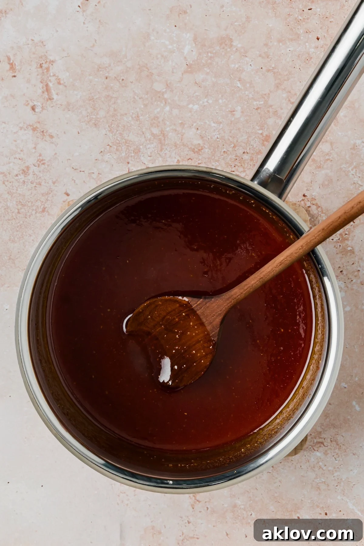 Sauce ingredients in stainless steel saucepan after being cooked.