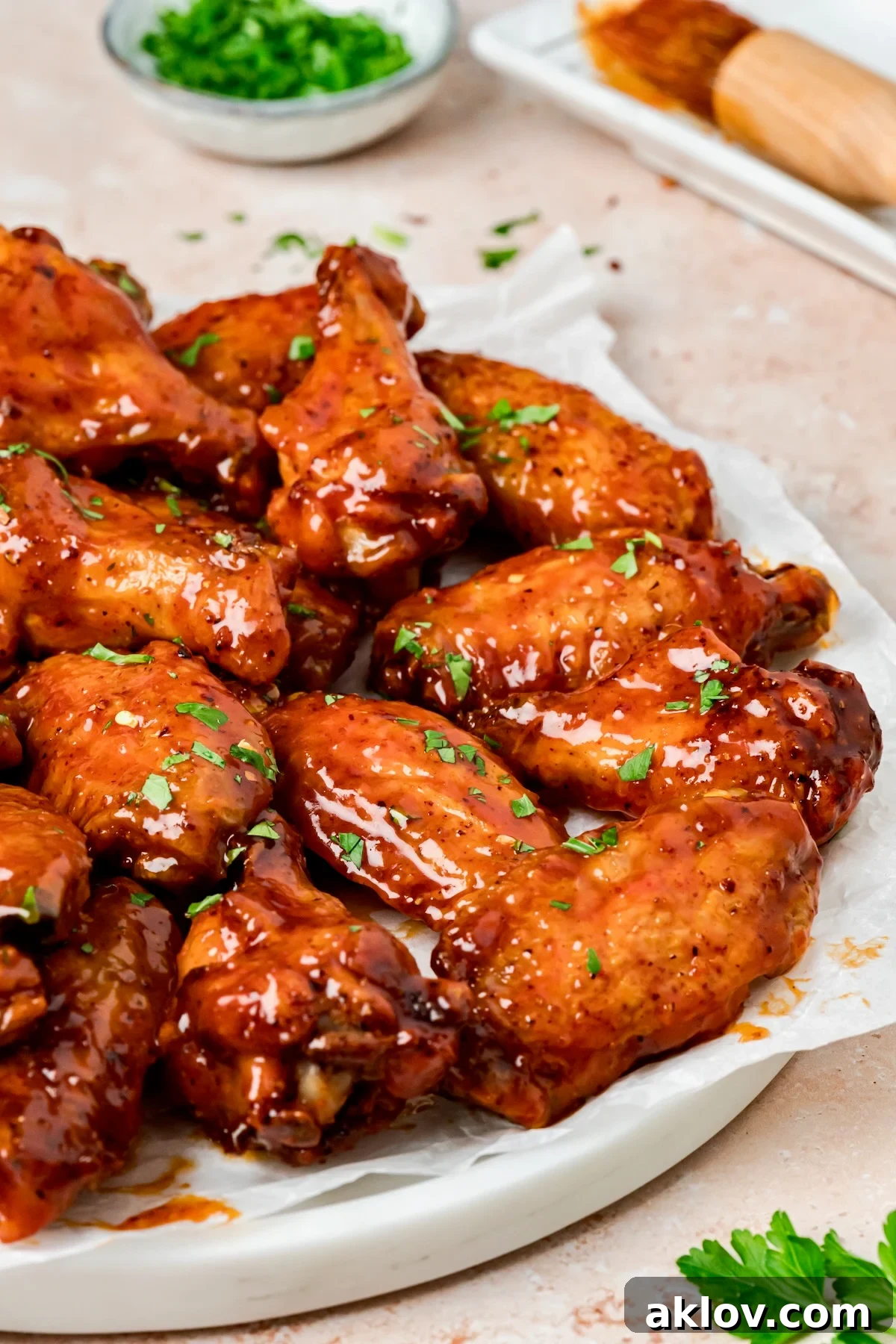 Hot Honey Chicken Wings on parchment paper lined platter.