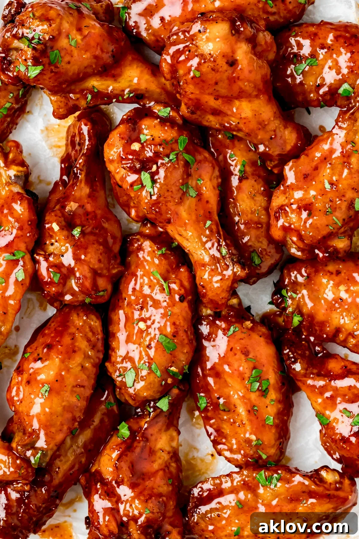 Hot Honey Chicken Wing garnished with chopped parsley.