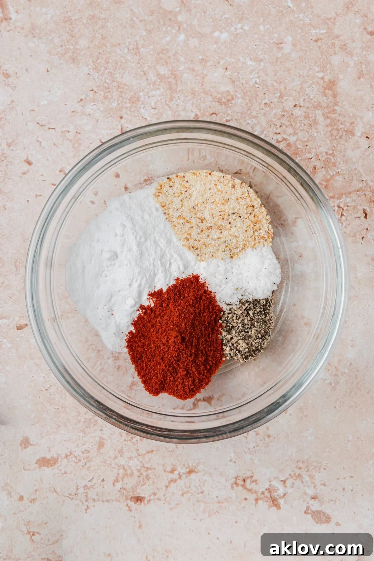 Ingredients for Hot Honey Chicken Wings rub in glass bowl before being combined.