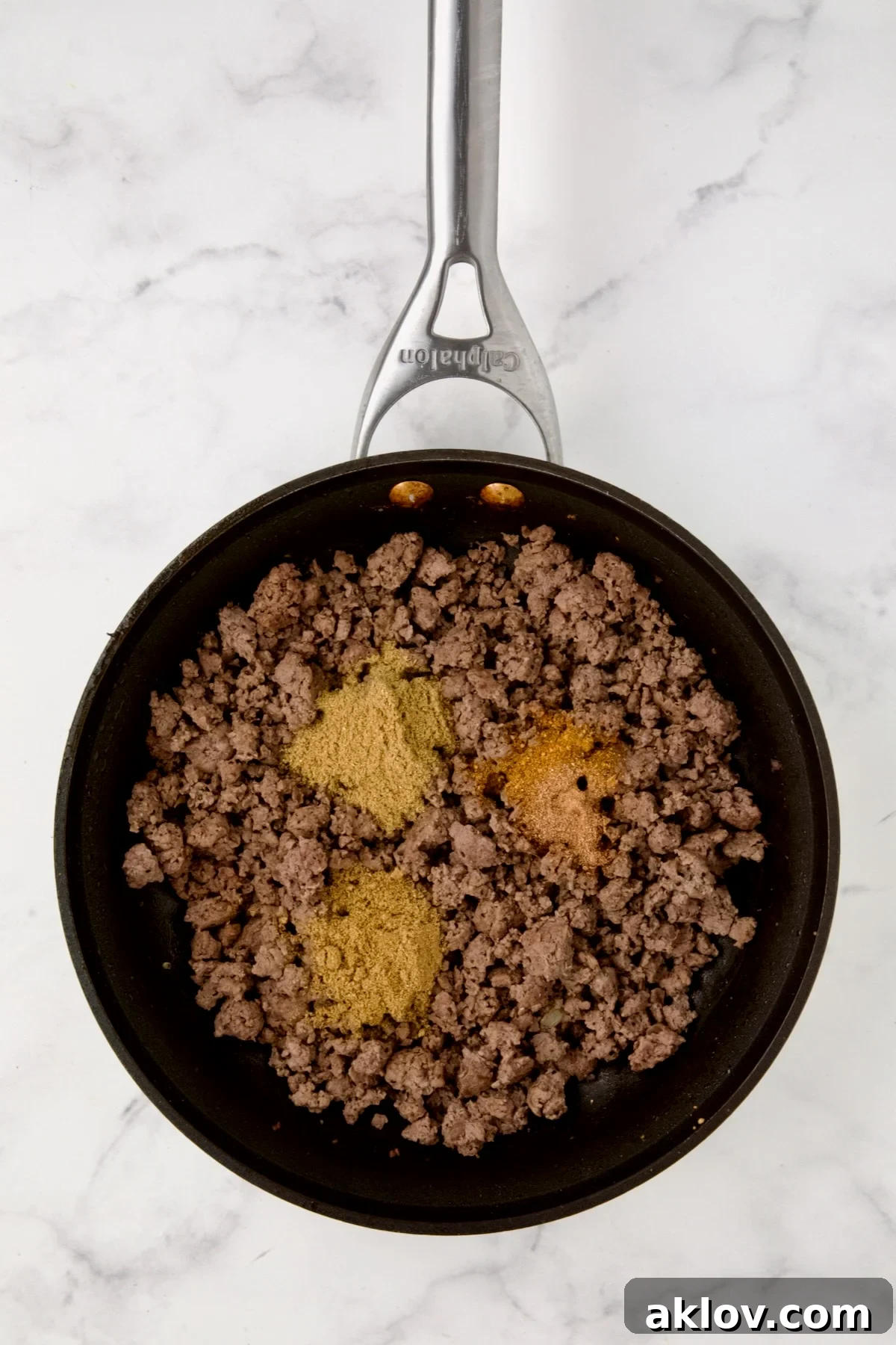 Cooked ground beef in nonstick skillet with coriander, cumin, nutmeg and cayenne added.