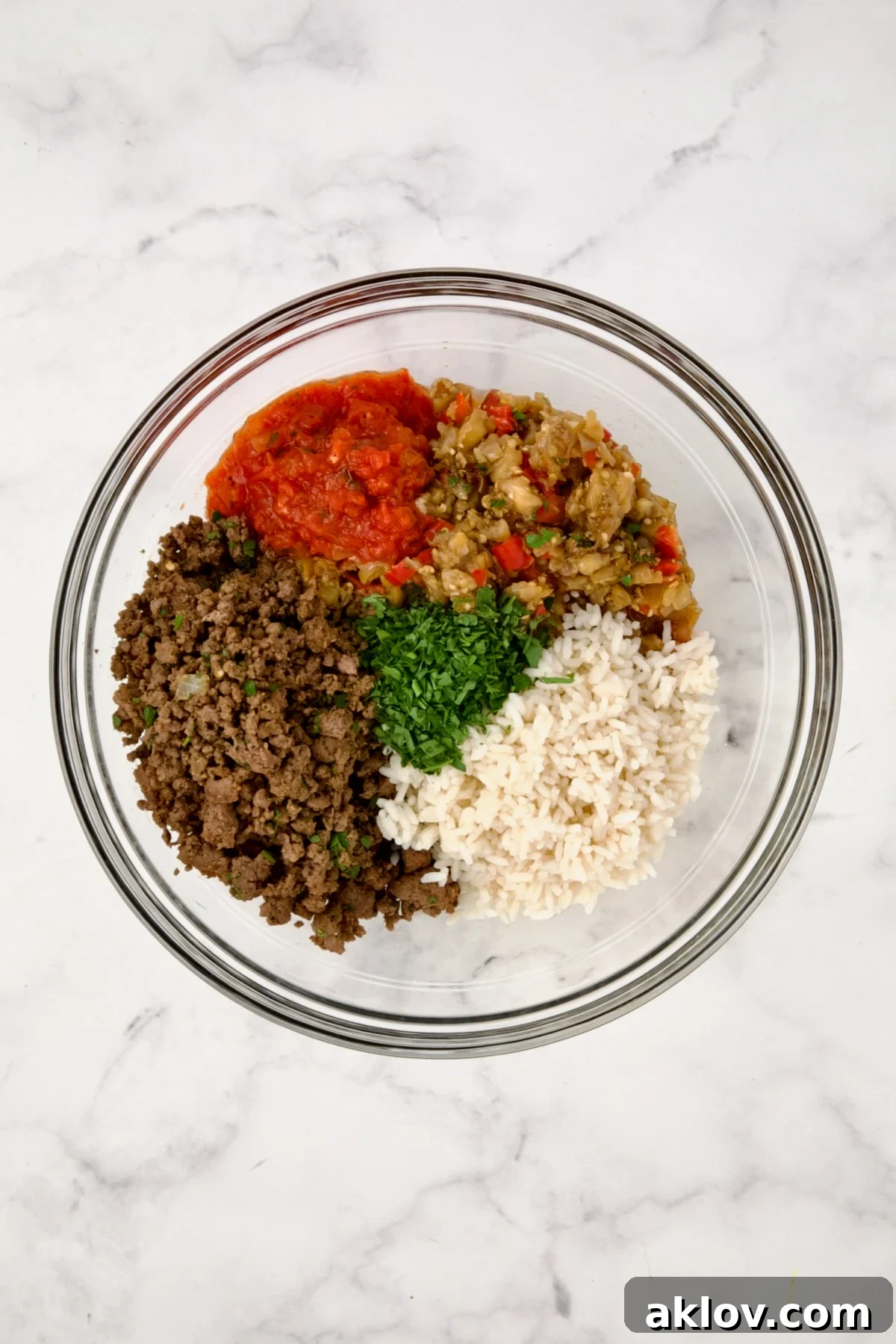 Filling for Stuffed Eggplant in glass bowl before being mixed together.