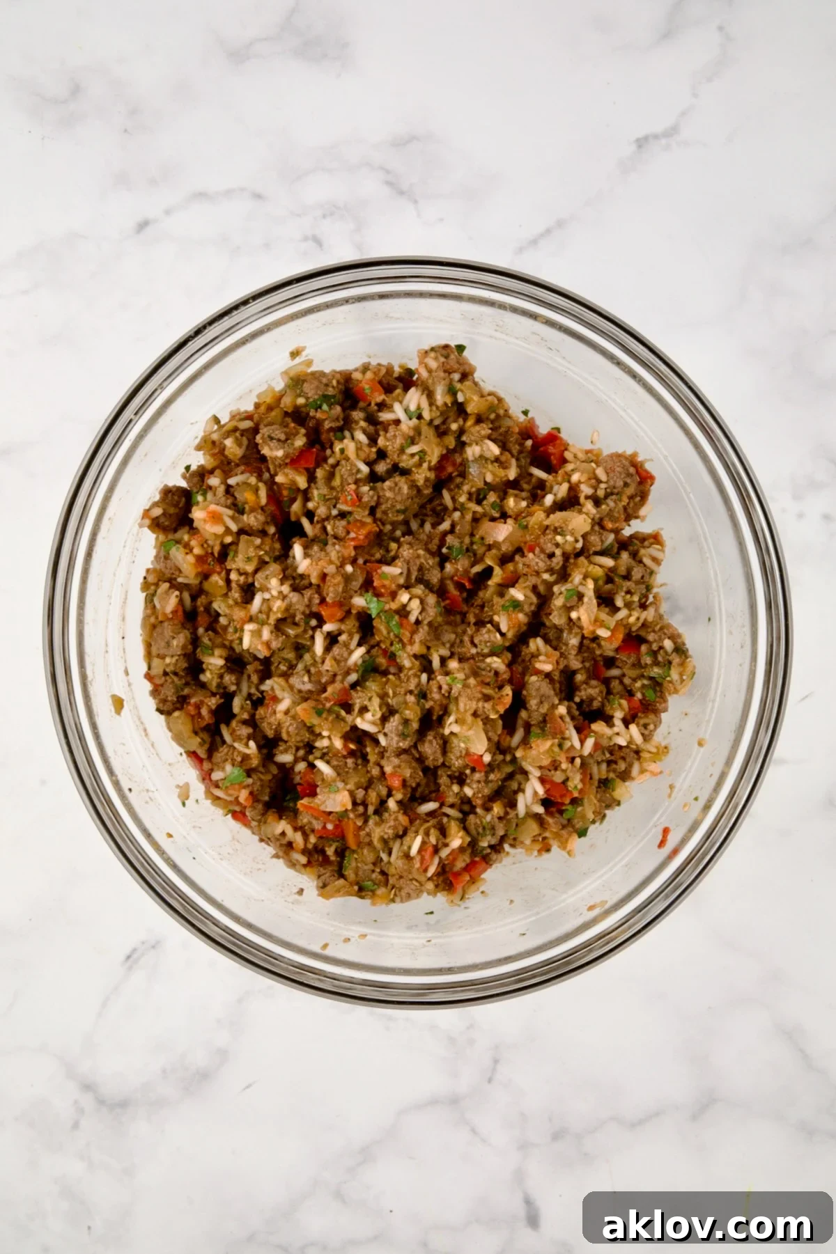 Filling for Stuffed Eggplant in glass bowl before after mixed together.
