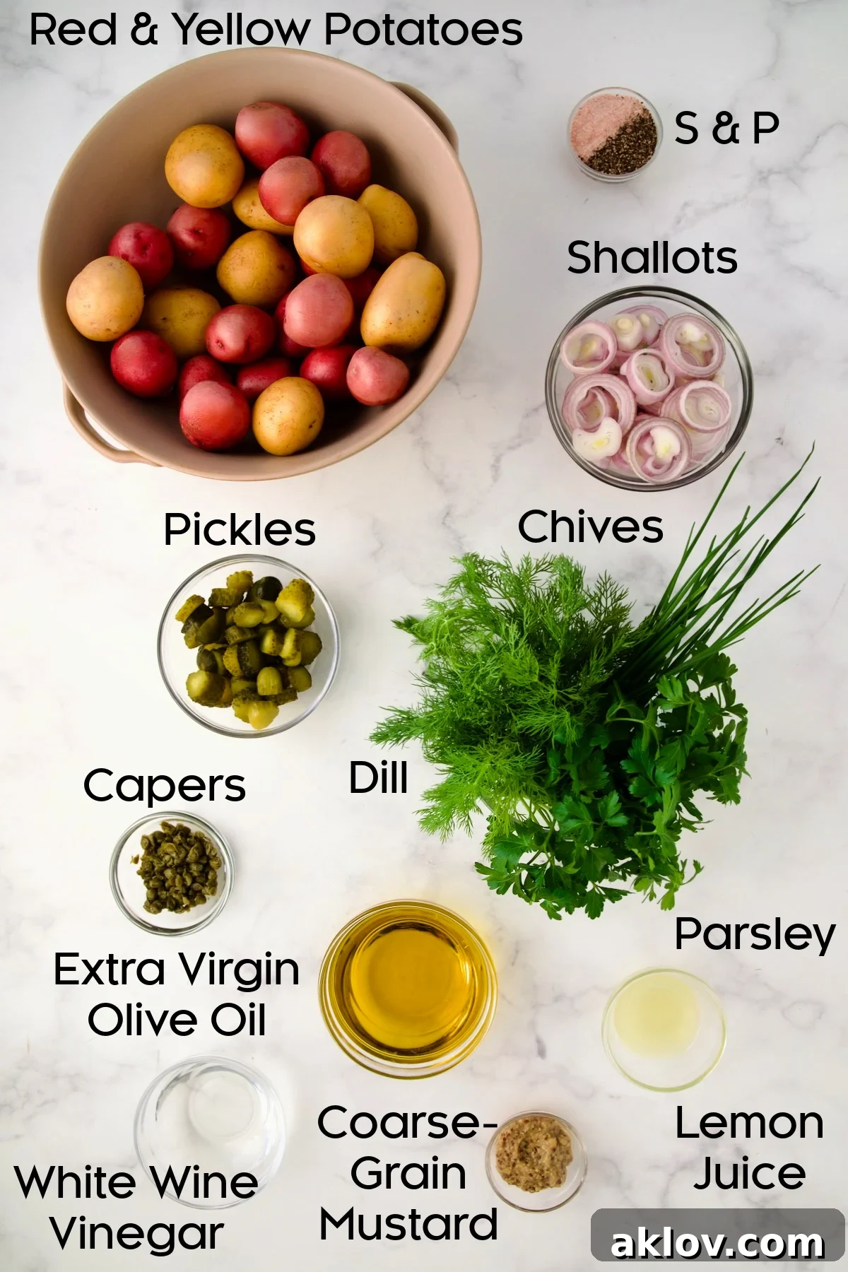 Ingredients for Herb and Vinegar Potato Salad in glass bowls.