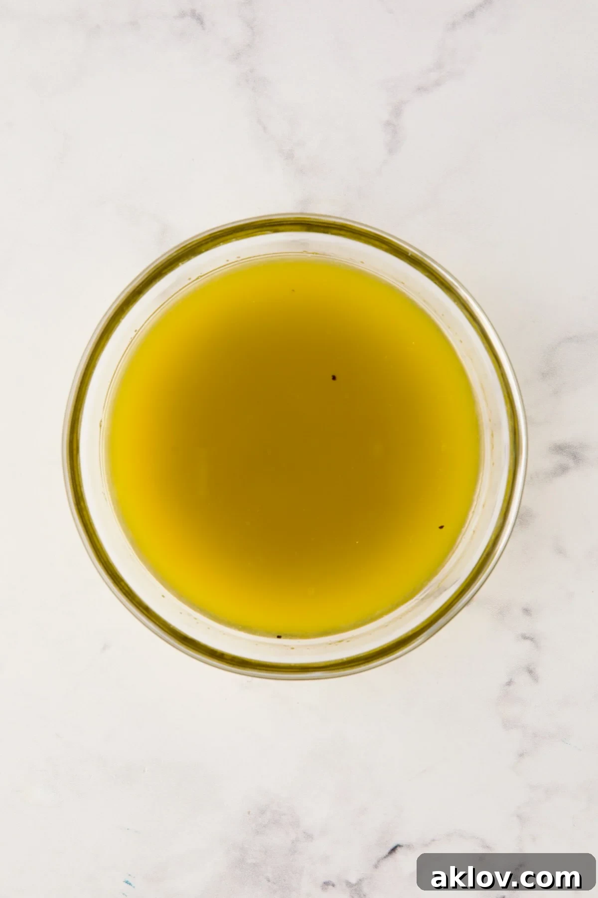 Vinaigrette for potato salad in glass bowl.
