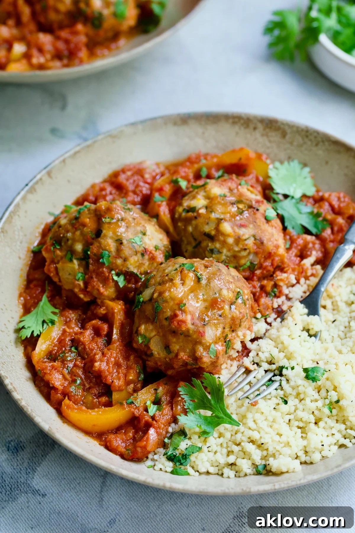 A serving of harissa chicken meatballs in a bowl, ready to eat.