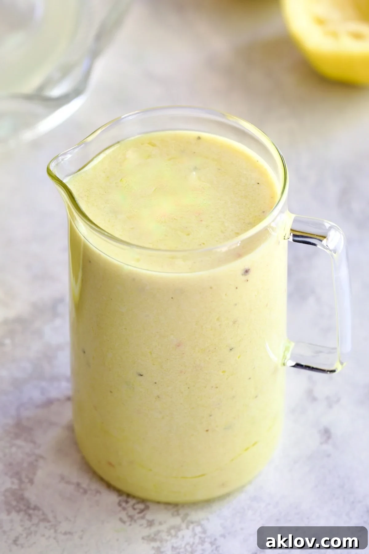 Creamy Lemon Dressing in glass pitcher.