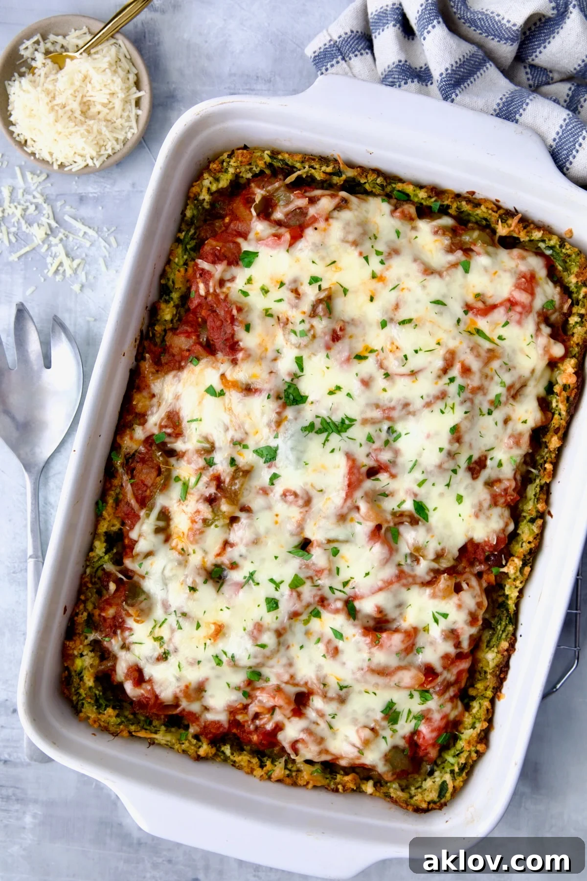 Zucchini Pizza Casserole in white rectangular baking dish before being cut.