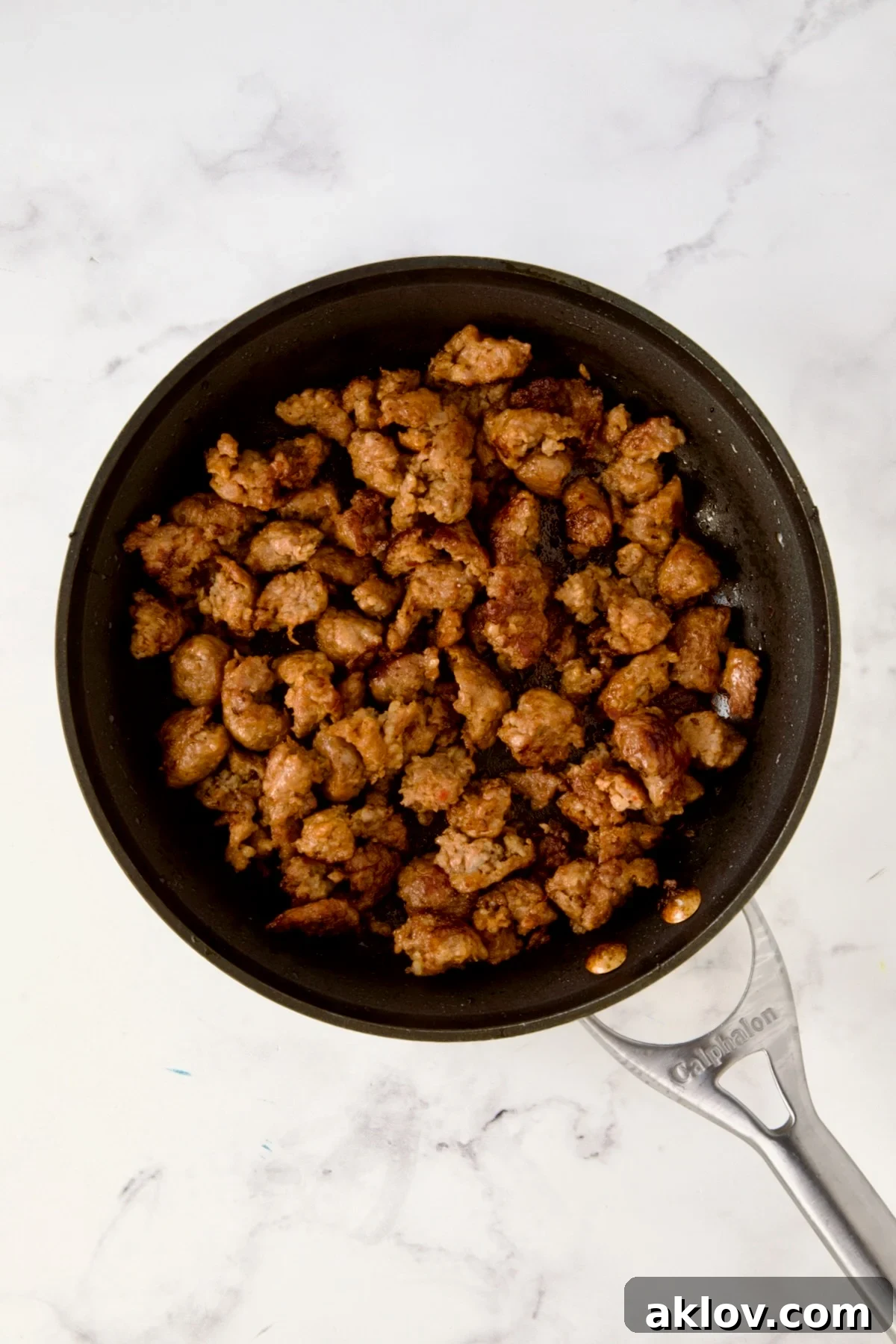 Cooked Italian sausage in nonstick skillet.