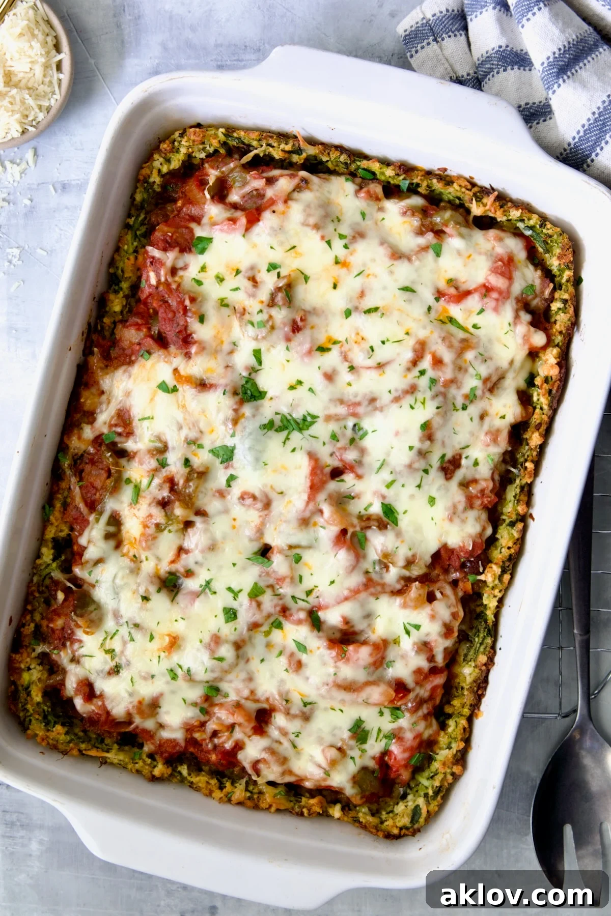 Zucchini Pizza Casserole in white rectangular baking dish after being baked.