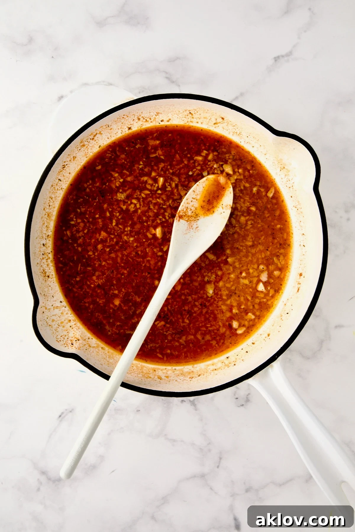 Reduced sauce in skillet.