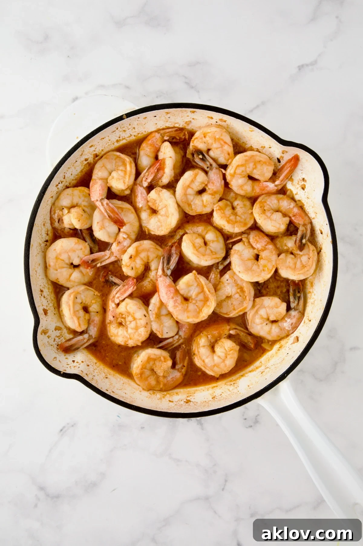 Shrimp added to reduced sauce.