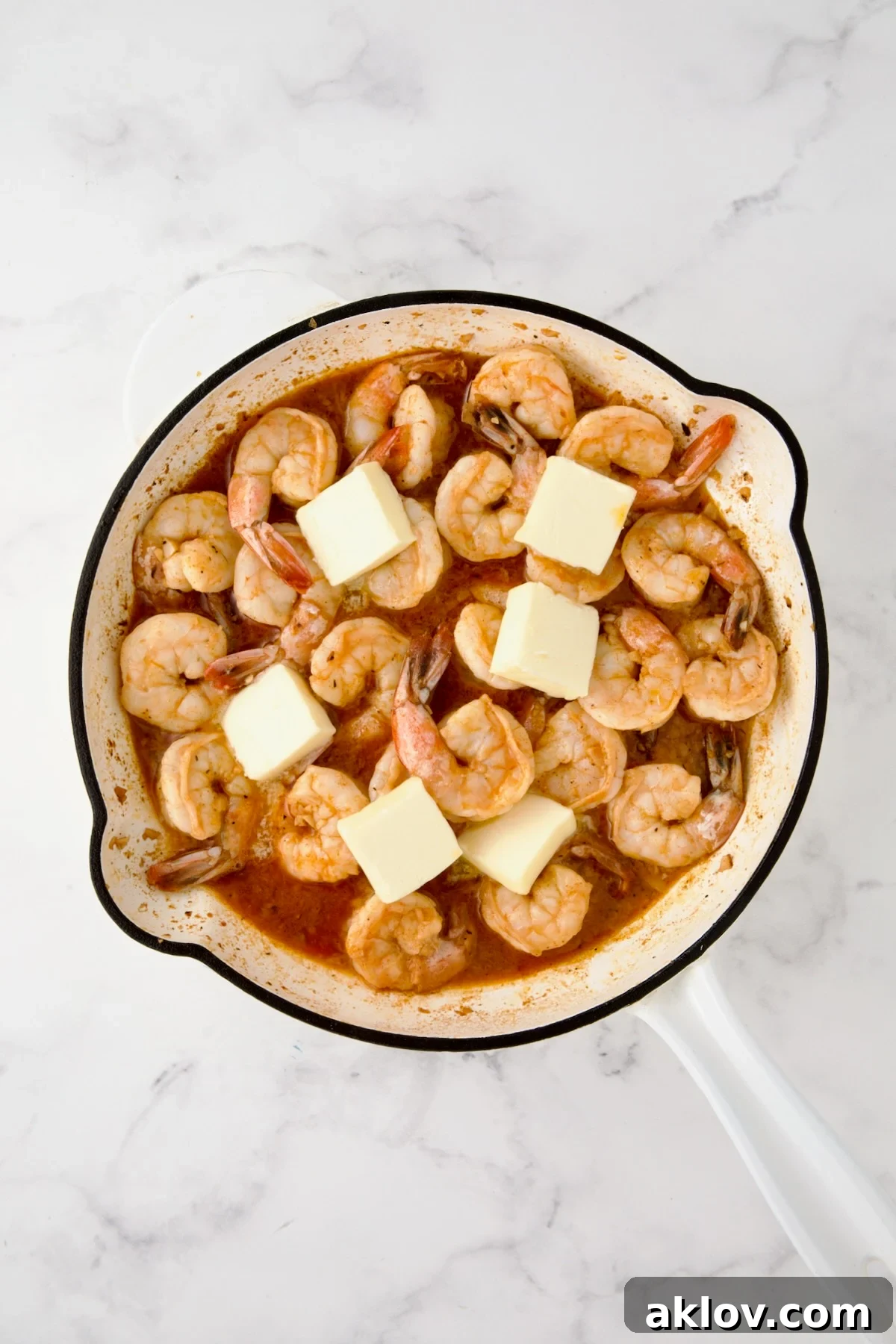 Butter added to cooked shrimp.