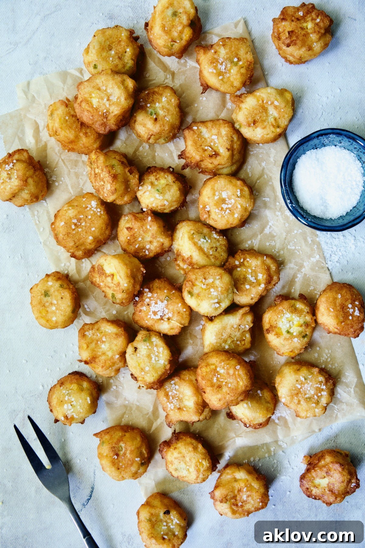 Fried squash puppies on parchment paper.