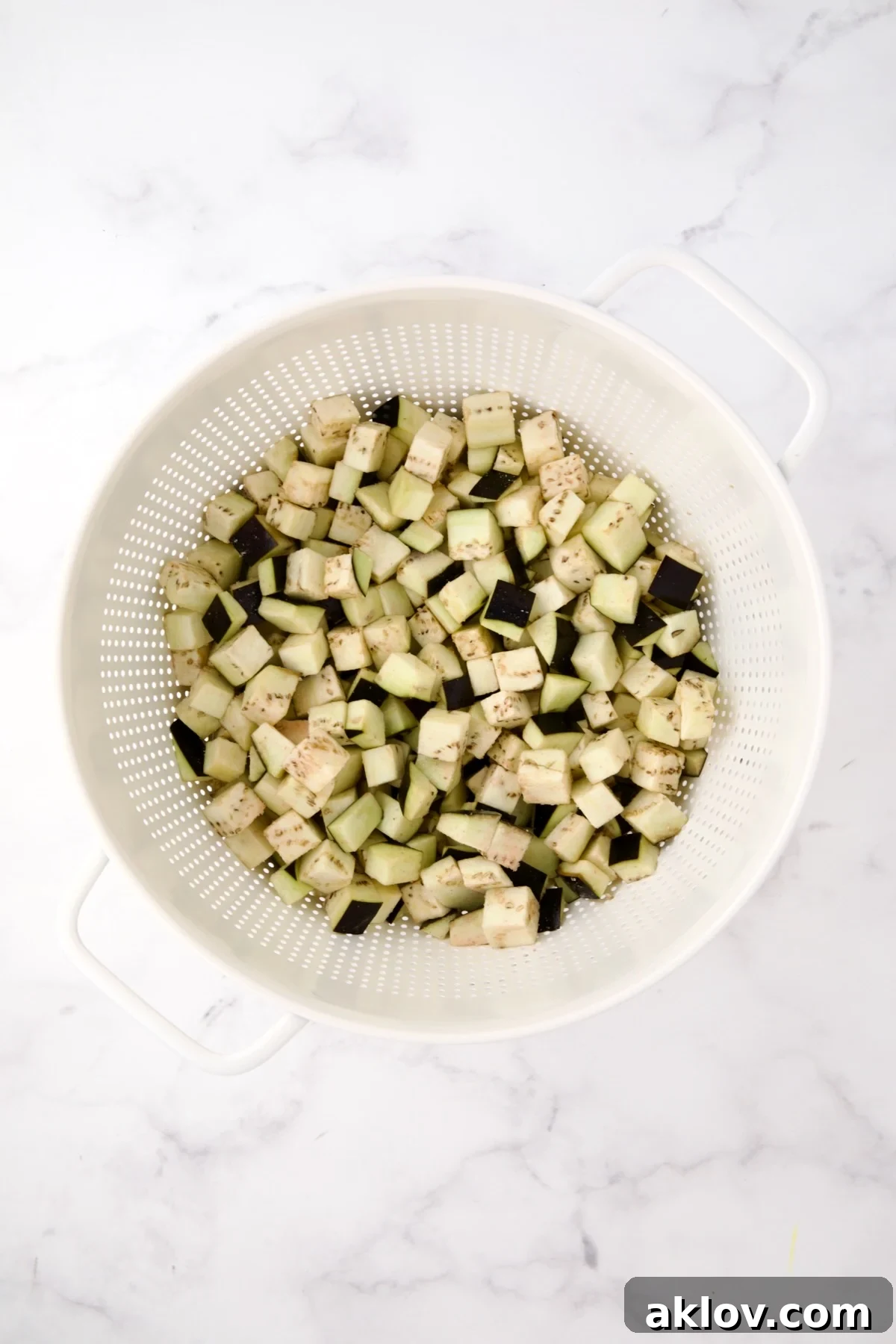 Cubed eggplant in colander