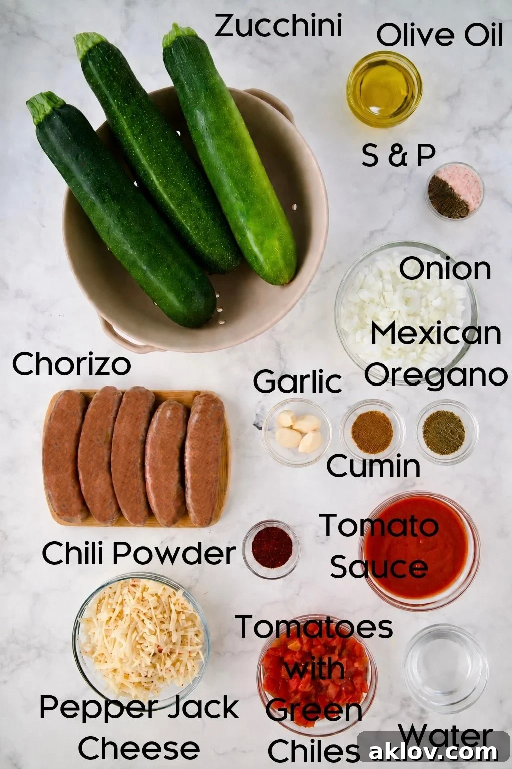 Ingredients for Chorizo-Stuffed Zucchini in glass bowls.