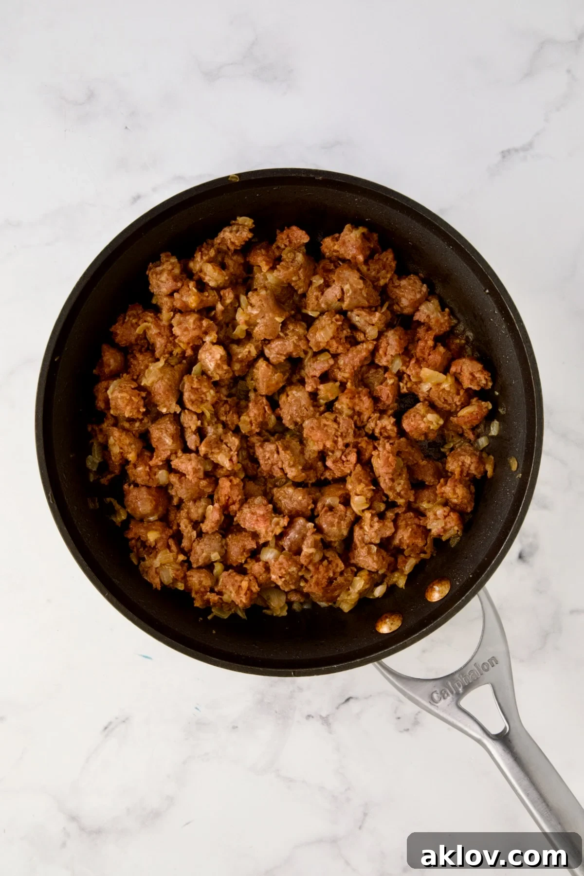 Cooked chorizo and onions in nonstick skillet.