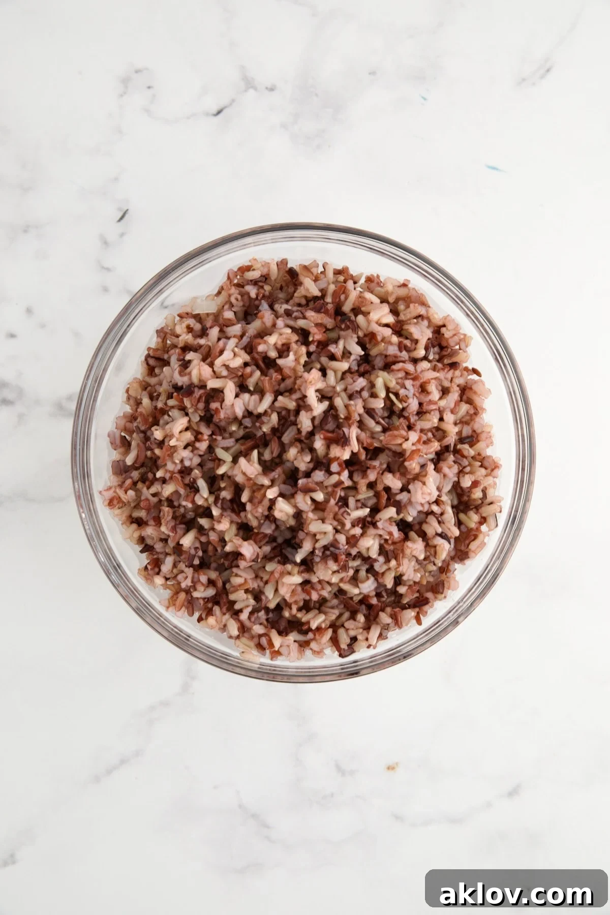 Cooked wild rice blend in glass bowl.